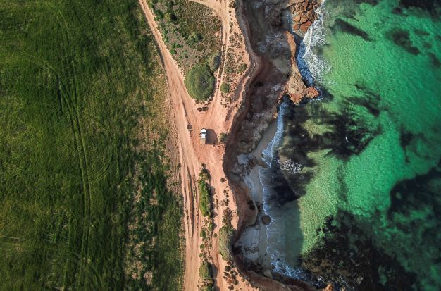 Aerial of crops and the ocean near Arno Bay