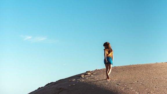 Girl on a sand dune at Port Gibbon (Megan Crabb)