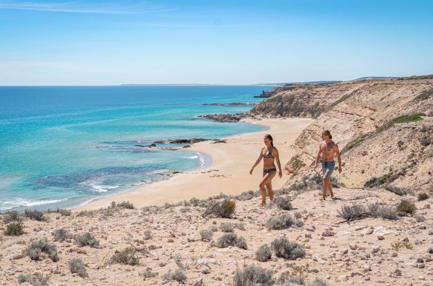 Two people walking on the cliffs above Greenly Beach